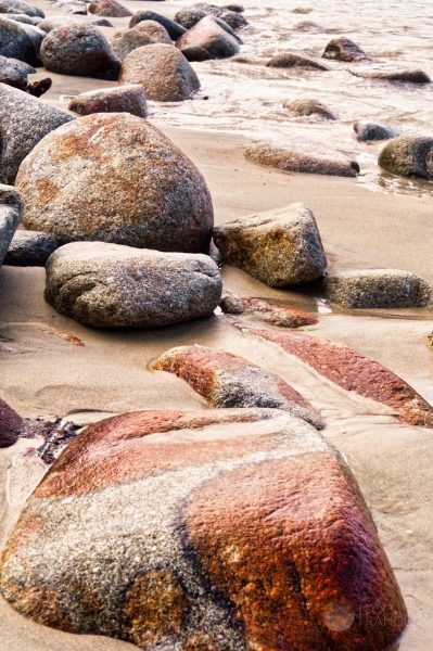 The beach below Cannery Row, on Monterrey Bay. Photographed in the fall of 2003, reprocessed in early 2021 using  Skylum Luminar AI.