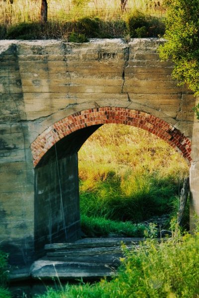 An old railroad bridge for the Rock Island Railroad crossing Spring Creek behind my former property in Lincoln County, SD. Photographed in September of 2004, processed in February of 2021 using Skylum Luminar AI and Topaz Sharpen AI.